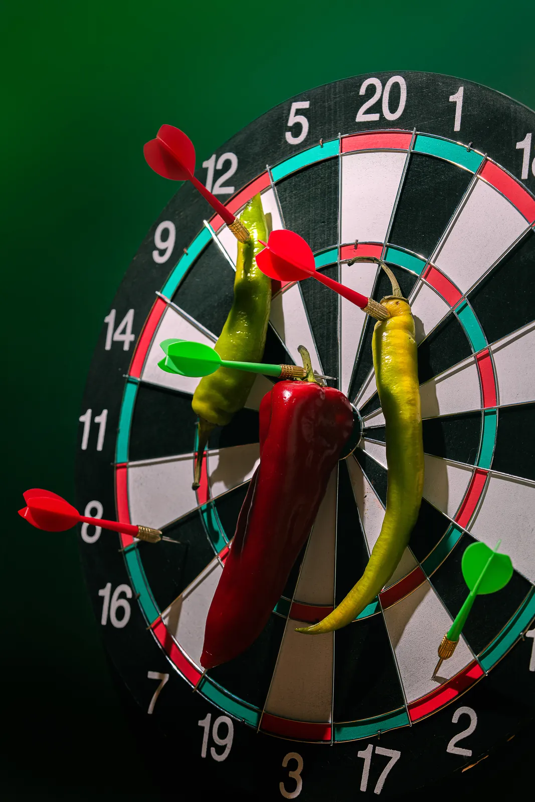 Chillies pinned to a dartboard like darts