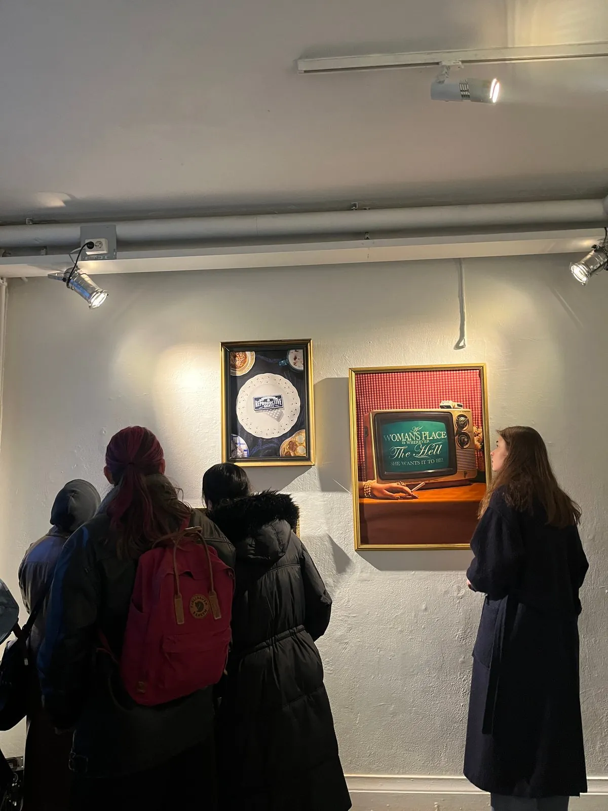Visitors in front of Thurees's photographs at Galleri Rotor2