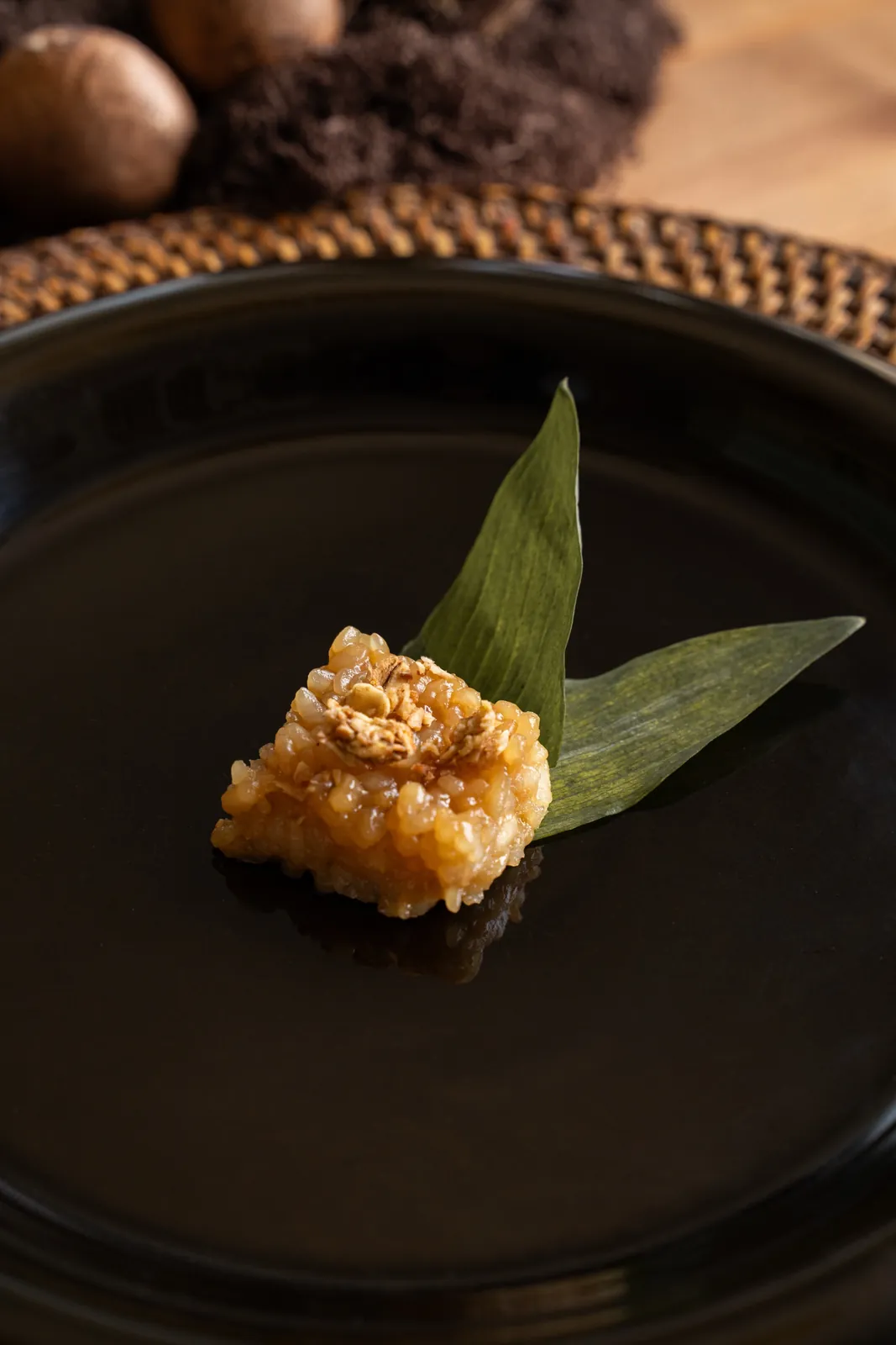 Biko on a pandan leaf on a black plate