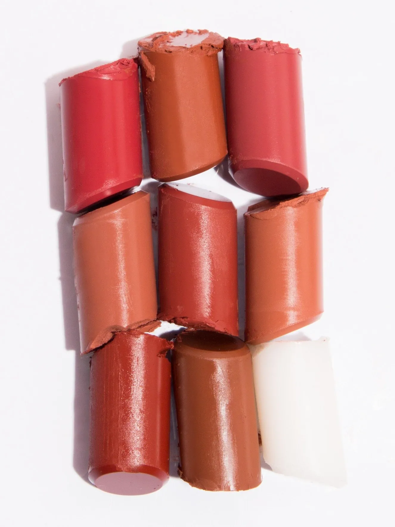 Lipstick bullets cut flat in a grid of shades