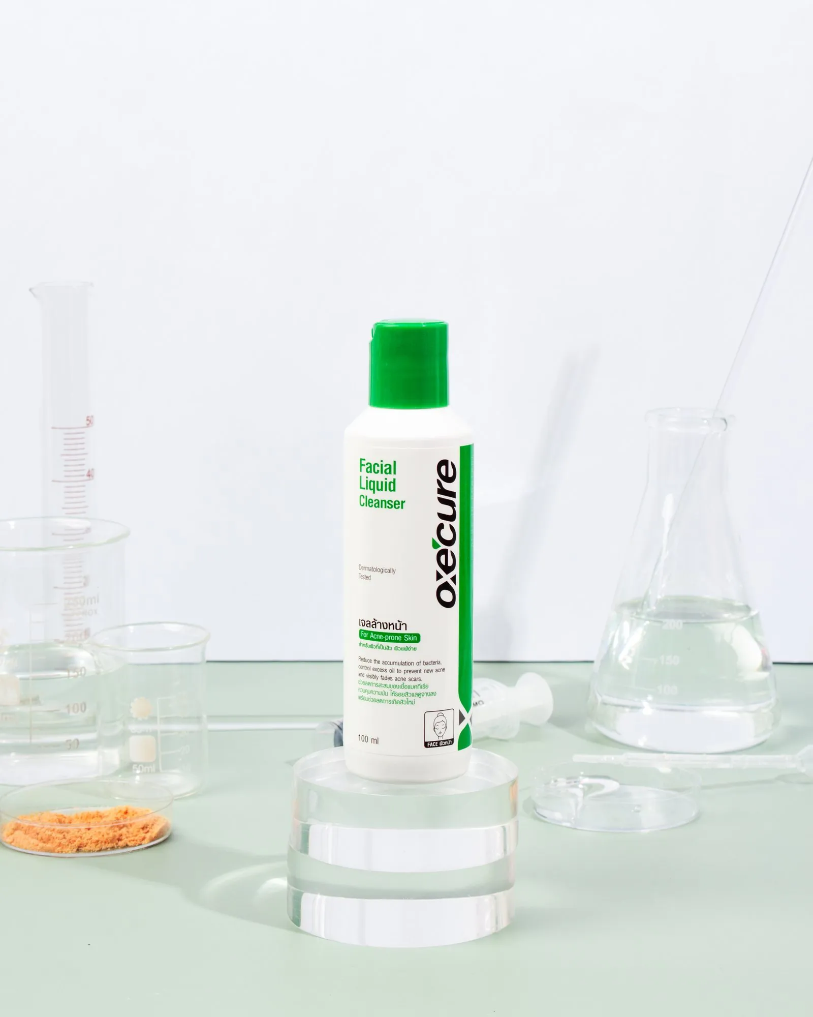 An Oxecure cleanser among lab glassware on mint