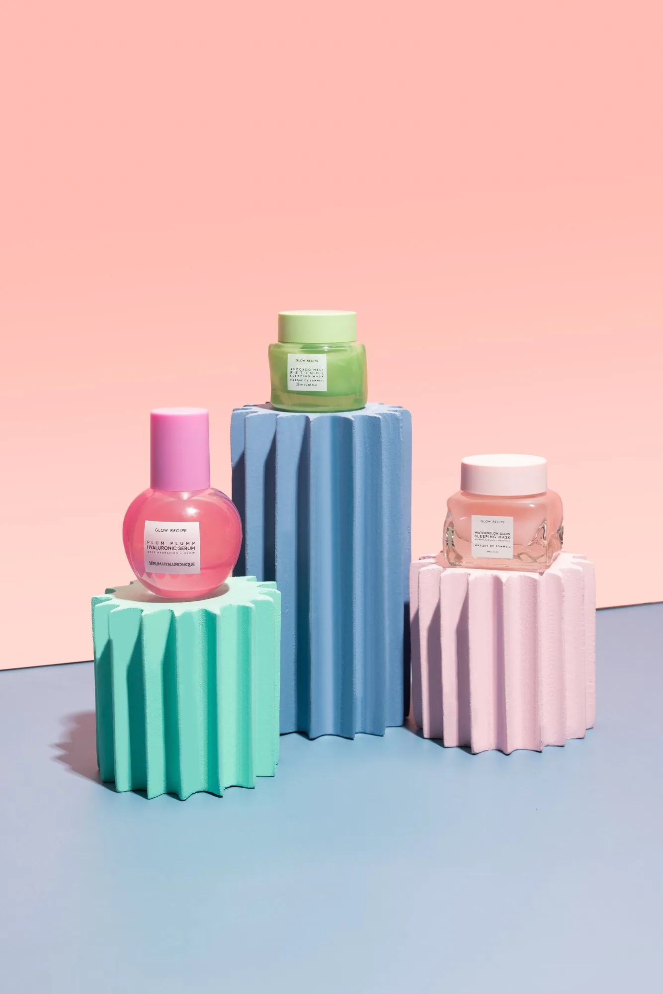 Glow Recipe jars on pastel fluted plinths