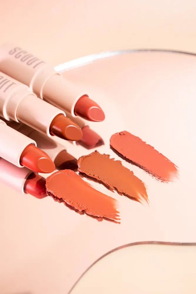 Scout lipsticks and their swatches on peach