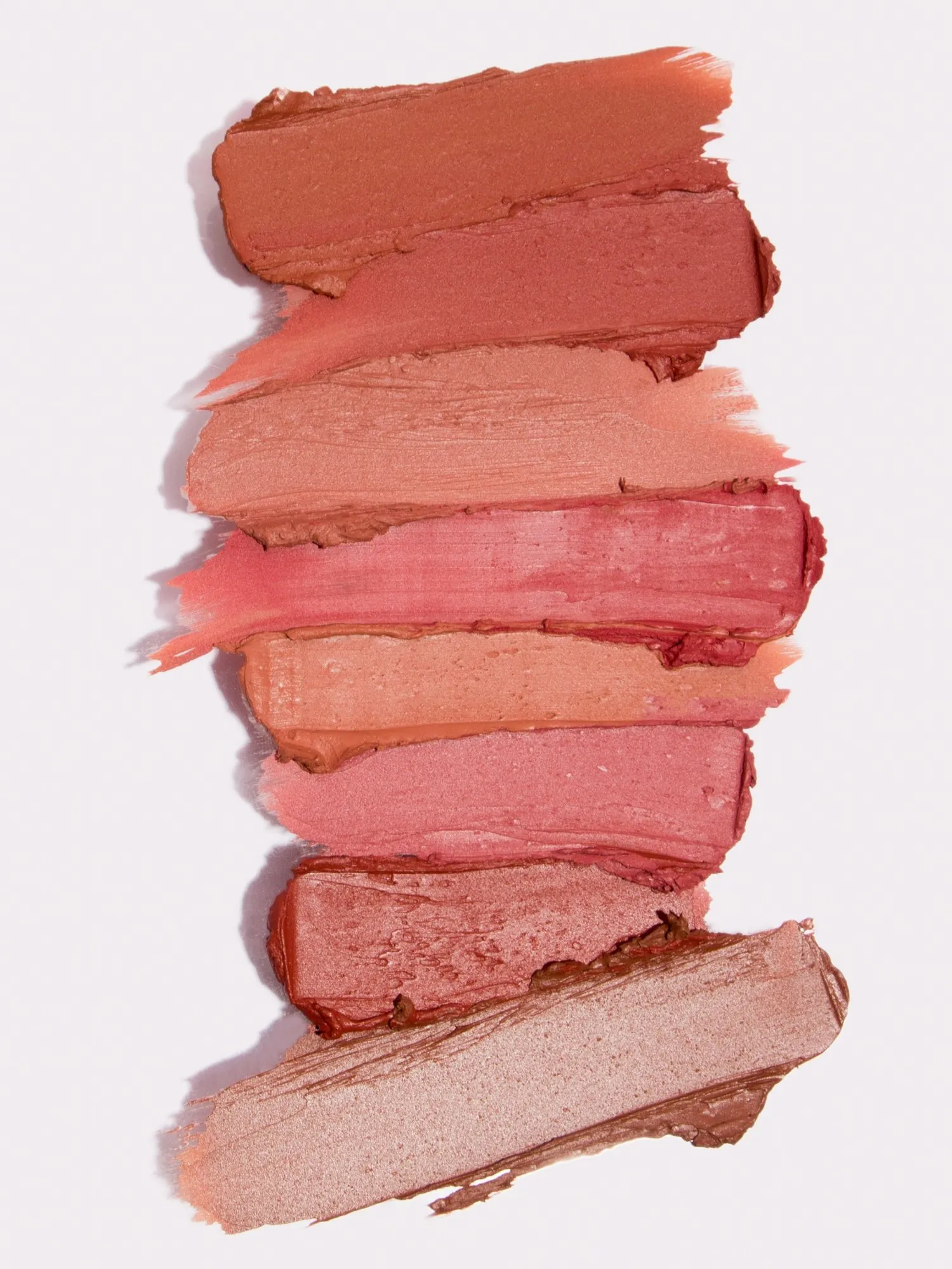 Lipstick swatches stacked from nude to berry